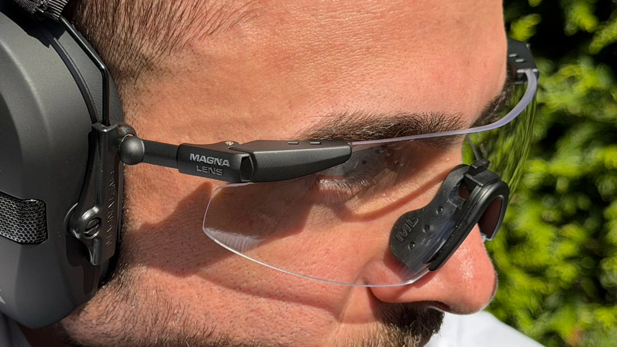 Close up of Magna Lens magnetic eyewear docked to the outside of an earmuff, leaving the cushion seal intact